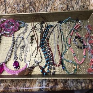Tray of all wearable jewelry. Mostly necklaces